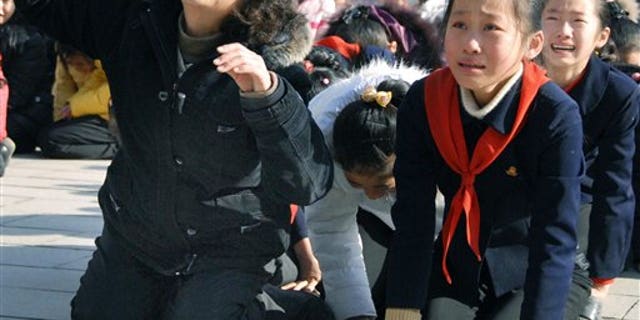 December 19, 2011: North Korean women cry after learning death of their leader Kim Jong Il.
