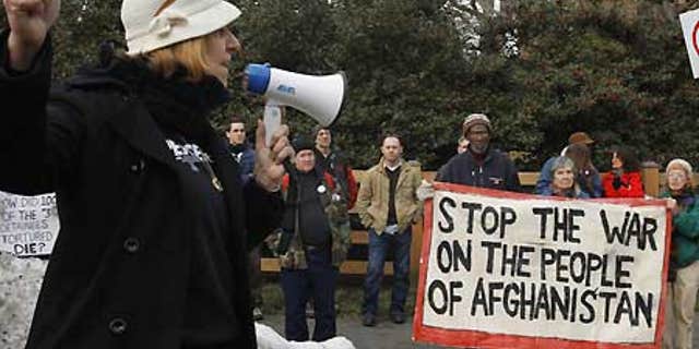 Jan. 16: Activist Cindy Sheehan points down the road toward former Vice President Dick Cheney's house during an anti-war protest in Langley, Va.