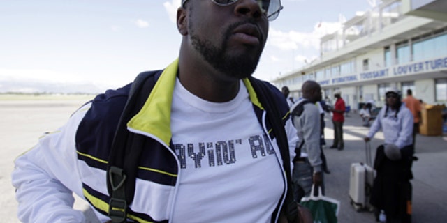 Jan. 13: Musician Wyclef Jean, a native of Haiti, arrives at the airport in Port-au-Prince in the aftermath of a devastating earthquake.