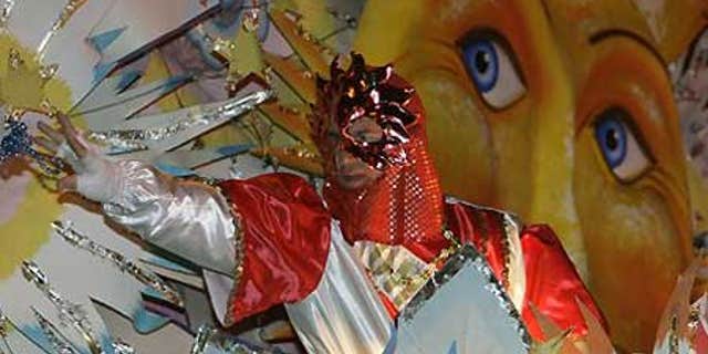 Feb. 23: A rider on a float throws beads during the Krewe of Orpheus parade in the Uptown area of New Orleans as Mardi Gras enters its final hours.