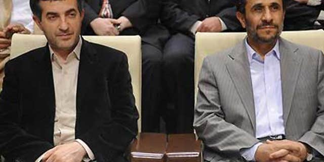 June 22: Iranian President Ahmadinejad, right, with his controversial choice for First Vice President, Esfandiar Rahim Mashai.