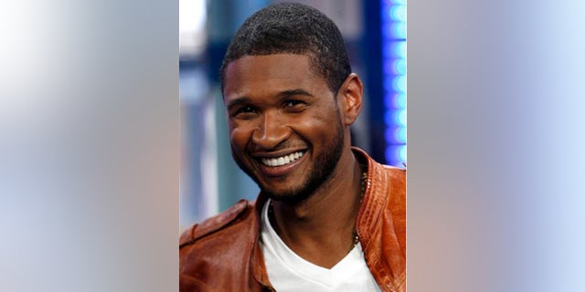 ** FILE ** In this May 27, 2008 file photo, Usher is shown on MTV's Total Request Live in New York. (AP Photo/Jason DeCrow, file)