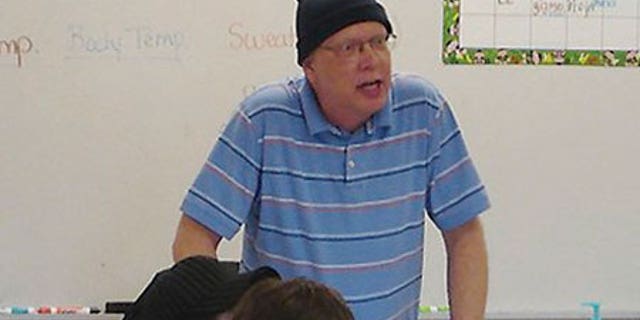 Undated 2008 photo: Bill Sparkman speaks to a 7th grade class during a lesson about sound waves.