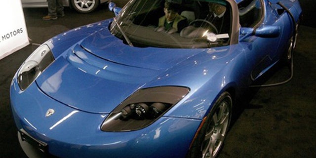 March 4: A battery-powered Tesla Roadster car is displayed.