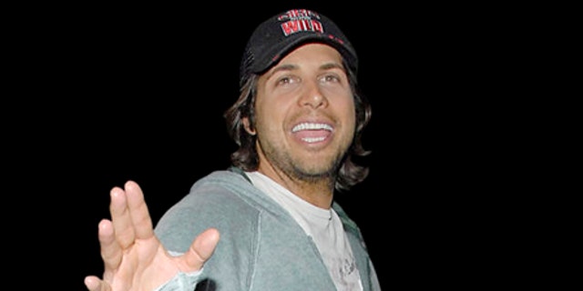 Mar. 12, 2008: Joe Francis, "Girls Gone Wild" creator, waves to fans and the press at the Los Angeles International Airport in California.