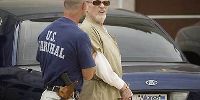 July 14: Evangelist Tony Alamo is led from the federal courthouse in Texarkana, Ark., following opening statements in his trial.