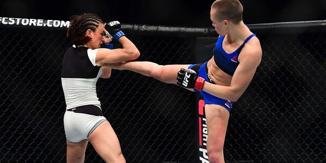 Apr 15, 2017; Kansas City, MO, USA; Rose Namajunas (Red Gloves) fights Michelle Waterson (Blue Gloves) during UFC Fight Night at the Sprint Center. Mandatory Credit: Ron Chenoy-USA TODAY Sports