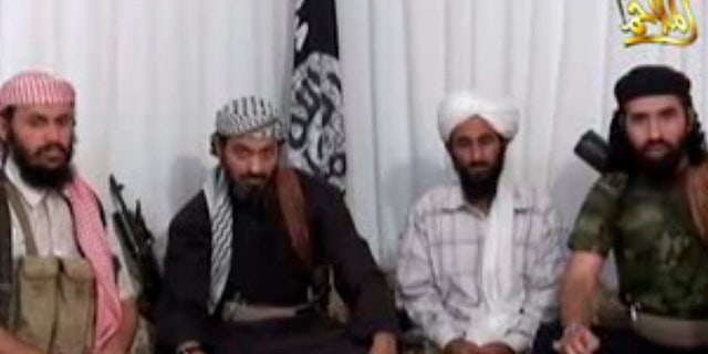 FILE: Jan. 24, 2009. The leader of Al Qaeda in Yemen, Nasser al-Wahaishi, second from right, is surrounded by deputies in an Internet video.