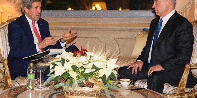 US Secretary of State, John Kerry, meets with Israel Prime Minister Benjamin Netanyahu at Villa Taverna, Rome, on Monday, Dec. 15, 2014. Kerry and Netanyahu met as the U.S. and Israel developed their responses to a draft U.N. resolution that would set a two-year timetable for an Israeli-Palestinian peace accord. (AP Photo/Evan Vucci, Pool)