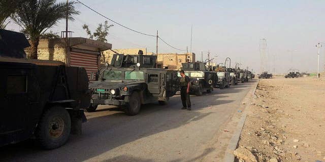Iraqi anti-terrorism forces enter Ramadi from the eastern side, Iraq, Saturday, April 18, 2015. In Iraq's western Anbar province, Iraqi special forces maintained control of the provincial capital, Ramadi, after days of intense clashes with the Islamic State group left the city at risk. Sabah Nuaman, a special forces commander in Anbar, said the situation had improved after airstrikes hit key militant targets on the city's fringes. (AP Photo)
