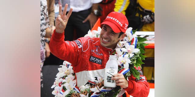 FILE - In this May 24, 2009 file photo, Helio Castroneves, of Brazil, holds up three fingers after winning his third Indianapolis 500 auto race, at Indianapolis Motor Speedway in Indianapolis, Ind. (AP Photo/Darron Cummings, File)