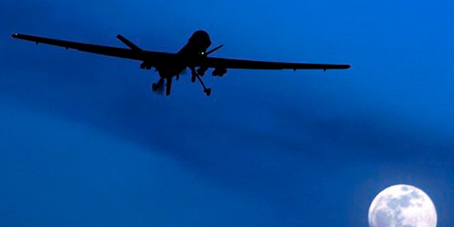 FILE: Jan. 31, 2010: An unmanned U.S. Predator drone flies over Kandahar Air Field on a moon-lit night.