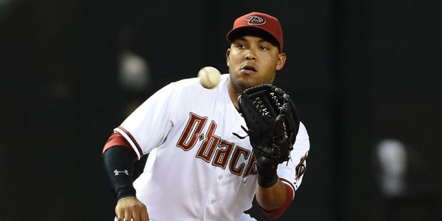 PHOENIX, AZ - APRIL 24:  Yasmany Tomas #24 of the Arizona Diamondbacks catches a throw from the catcher after a strike out in the fourth inning against the Pittsburgh Pirates at Chase Field on April 24, 2015 in Phoenix, Arizona.  (Photo by Norm Hall/Getty Images)