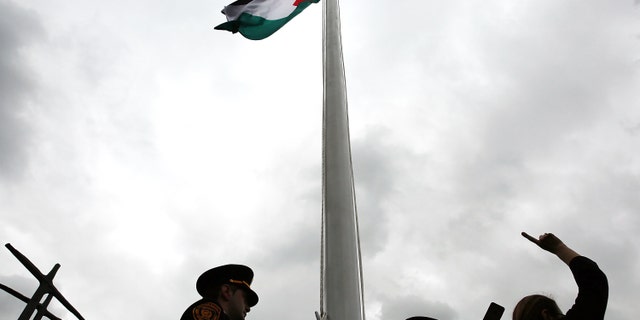 NEW YORK, NY - SEPTEMBER 30: The Palestinian flag is raised for the first time at the United Nations Headquarters on September 30, 2015 in New York City. Following the statements of Palestinian President Mahmoud Abbas, the flag was raised in the Rose Garden at 1:00 pm local time in front of a large crowd of diplomats, journalists and Palestinian supporters. (Photo by Spencer Platt/Getty Images)