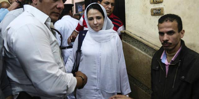 FILE -- In this Sunday, April 16, 2017 file photo, Aya Hijazi, center, a dual U.S.-Egyptian citizen, is acquitted by an Egyptian court after nearly three years of detention over accusations related to running a foundation dedicated to helping street children, in Cairo, Egypt. Hijazi's lawyer, Taher Abol Nasr, said she was released from prison late Tuesday, April 18, 2017, two days after a court acquitted her of charges of child abuse that were widely dismissed as bogus by human rights groups and U.S. officials. (AP Photo/Mohamed el Raai, File)