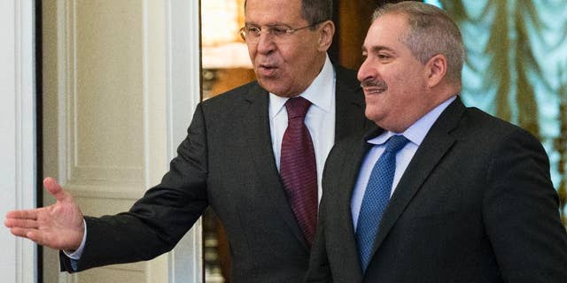 Russian Foreign Minister Sergey Lavrov, left, welcomes Jordanian Foreign Minister Nasser Judeh before their talks in Moscow, Russia, Thursday, June 9, 2016. The talks focused on bilateral ties and the situation in Syria. (AP Photo/Alexander Zemlianichenko)