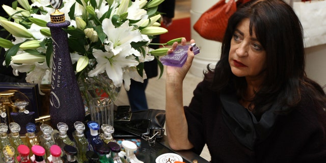 NEW YORK - DECEMBER 19: Laurice Rahme signs bottles of her Bond No. 9 perfume for the 'Ultimate NY Gift' at Saks Fifth Avenue on December 19, 2009 in New York City. (Photo by Neilson Barnard/Getty Images for Bond No. 9)