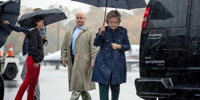 Democratic presidential candidate Hillary Clinton arrives to board her campaign plane at Westchester County Airport in White Plains, N.Y., Friday, Oct. 21, 2016, to travel to Cleveland for a rally. (AP Photo/Andrew Harnik)