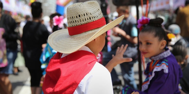 DENVER, CO - MAY 04: Children dressed in traditional Mexican attire attend a Cinco de Mayo festival on May 4, 2013 in Denver, Colorado. Hundreds of thousands of people were expected to attend the two day event, billed as the largest Cinco de Mayo celebration in the United States. Cinco de Mayo observes the victory of the Mexican army over French forces on May 5, 1862 in the town of Puebla, Mexico. The festival celebrates Mexican culture and is one of the most popular annual Latino events in the United States. (Photo by John Moore/Getty Images)