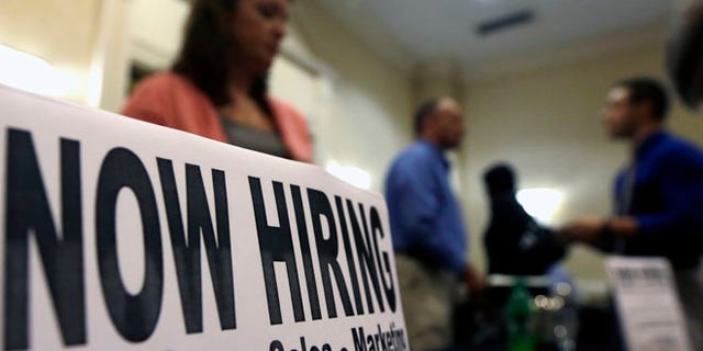 In this Thursday, Oct. 25, 2012, photo, a sign attracts job-seekers during a job fair at the Marriott Hotel in Colonie, N.Y. According to government reports released Friday, Nov. 2, 2012, the U.S. economy added 171,000 jobs in October, and the unemployment rate ticked up to 7.9 percent. (AP Photo/Mike Groll)