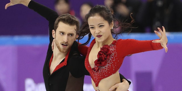 Min Yu-ra and Alexander Gamelin of South Korea compete in a performance in which her top nearly came off.