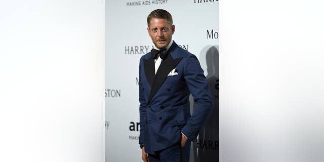 FILE - In this Sept. 26, 2015 file photo, Lapo Elkann arrives for an amfAR charity dinner in Milan, Italy. A criminal charge by the Manhattan district attorney has been dropped against the playboy grandson of the Italian founder of Fiat Automobiles who had been accused of filing a false report when he claimed he was being held against his will in New York City. The 39-year-old was arrested outside a public housing project in December 2016 after his family contacted police, saying he needed $10,000 to guarantee his safety. But authorities say he made up the story after he ran out of money following a two-day binge with an escort. (AP Photo/Giuseppe Aresu, File)