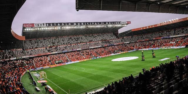 FILE- In this Wednesday, Feb. 17, 2016 file photo, a general view of the El Molinon stadium during their Spanish La Liga soccer match between Sporting de Gijon and FC Barcelona, in Gijon, northern Spain. Sporting Gijon said Thursday, Nov. 17, 2016, it has been ordered to close part of its stadium during one game in the Spanish league because its fans allegedly racially insulted a player from an opposing team. (AP Photo/Alvaro Barrientos, File)