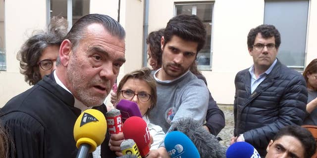 Lawyer Frank Berton, left, who represents Paris attacks suspect Salah Abdeslam, speaks to journalists outside an administrative tribunal in the Parisian suburb of Versailles, France, Wednesday, July 13, 2016. Berton is appealing to the tribunal to have two live video cameras removed from Abdeslam’s cell in the French prison of Fleury-Merogis, saying they risk damaging him psychologically. (AP Photo/Raphael Satter)