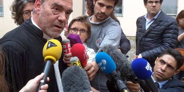 Lawyer Frank Berton, left, who represents Paris attacks suspect Salah Abdeslam, speaks to journalists outside an administrative tribunal in the Parisian suburb of Versailles, France, Wednesday, July 13, 2016. Berton is appealing to the tribunal to have two live video cameras removed from Abdeslam’s cell in the French prison of Fleury-Merogis, saying they risk damaging him psychologically. (AP Photo/Raphael Satter)