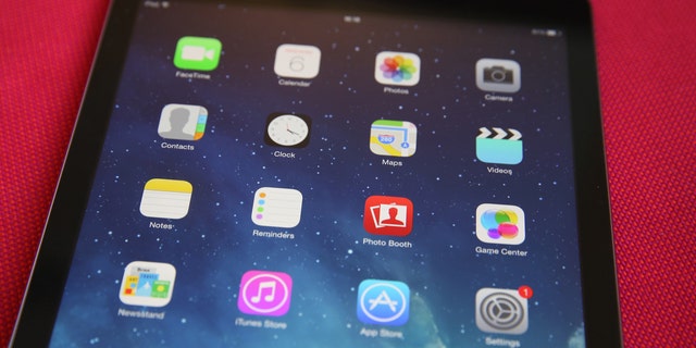 In this image, an Apple iPad shows its home screen.  (Photo illustration by Peter Macdiarmid / Getty Images)