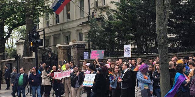 People protest outside the Russian Embassy in London, following reports of the torture and murder of gay men in Chechnya, Wednesday April 12, 2017. The United Nations’ High Commissioner for Human Rights called upon the Russian government in a statement “to put an end to the persecution of people perceived to be gay or bisexual, while Chechen authorities denied the reports, and spokesman for leader Ramzan Kadyrov insisted there were no gay people in Chechnya. (Thomas Hornall/PA via AP)