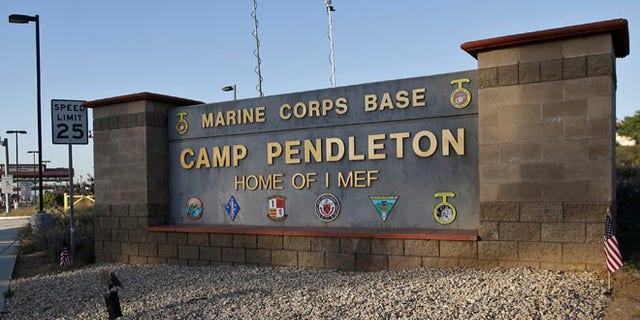 Nov. 13, 2013: Vehicles file through the main gate of Camp Pendleton Marine Base at Camp Pendleton, Calif.