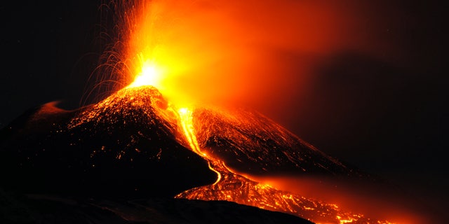FILE - In this Sunday, Dec. 15, 2013 filer, Mt. Etna volcano spews lava during an eruption near the Sicilian town of Catania, Italy. Ash fallout from Mount Etna's latest spectacular eruption has forced the closure of Catania's airport in eastern Sicily.The airport said it would remain closed at least until Monday evening. Several flight departures and arrivals were canceled, and at least two flights were diverted to Palermo's airport in the western part of the Mediterranean island. Etna is Europe's most active volcano. Its latest series of eruptions has lasted for weeks now, occasionally causing a change in flight routes. The eruption hasn't forced evacuation of the villages on the mountain's slopes. Its last major eruption occurred in 1992. (AP Photo/Salvatore Allegra, File)