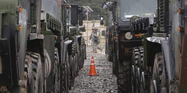 FILE - In this April 11, 2017 file photo, U.S. Marine soldiers patrol during the U.S.-South Korea joint Exercise Operation Pacific Reach in Pohang, South Korea. The Trump administration has settled on its North Korea strategy after a two-month review: “Maximum pressure and engagement.” (AP Photo/Ahn Young-joon, File)