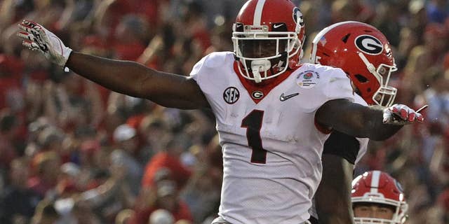 Georgia running back Sony Michel (1) celebrates after he scored a touchdown against Oklahoma during the second half of the Rose Bowl NCAA college football game Monday in Pasadena, Calif. (AP Photo/Jae C. Hong)