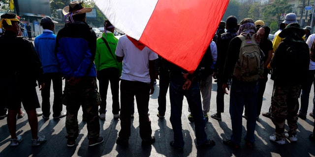 Anti-government protesters make their way on a street during a march Friday, Jan. 24, 2014 in Bangkok. Thailand’s Constitutional Court ruled Friday that nationwide elections scheduled for Feb. 2 can legally be delayed. (AP Photo/Wason Wanichakorn)