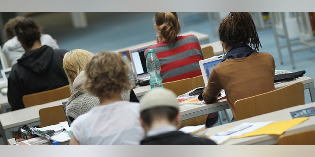 BERLIN, GERMANY - SEPTEMBER 20: Students study with their laptop computers in the Pedagogical Library at the Freie Universitaet university on September 20, 2011 in Berlin, Germany. German universities recorded a record 2.218 million matriculations in the 2010/2011 winter semester, a rise of 4.5%, and expect even more students in the coming winter semster, which starts in October. The end of compulsory military service in the Bundeswehr, the German armed forces, which went into effect earlier this year, is a major contributing factor to the rise in the numbers of students arriving at universities across the country. (Photo by Sean Gallup/Getty Images)