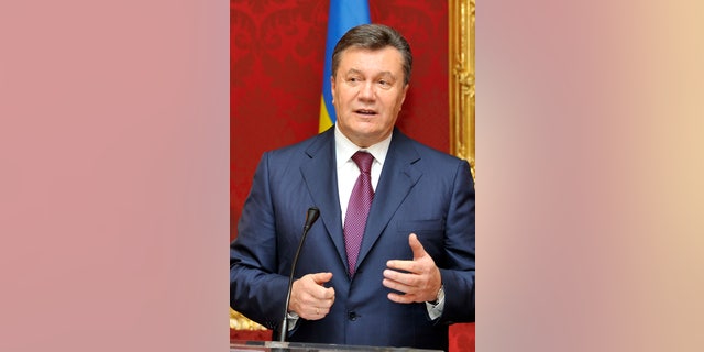 FILE - In this Thursday, Nov. 21, 2013 file photo, Ukrainian President Viktor Yanukovych speaks during a news conference after his meeting with Austrian President at the Hofburg palace, in Vienna, Austria. Yanukovych suffered a humiliation in 2004 when his victory in the fraud-tainted presidential election was declared void under the pressure of massive unprecedented protests dubbed the Orange Revolution, allowing his pro-Western rival to win power. But Yanukovych took advantage of the troubled economy and infighting in the Orange camp to win the 2010 presidential vote. (AP Photo/Hans Punz, File)