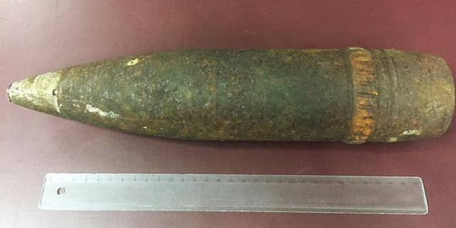 An American tourist was fined nearly $5,000 dollars after she tried to take a World War II artillery shell she found while hiking on her plane in Vienna, Austria.