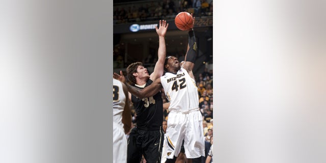 Missouri's Alex Oriakhi, right, pulls down a rebound in front of Vanderbilt's Shelby Moats, left, during the first half of an NCAA college basketball game Saturday, Jan. 26, 2013, in Columbia, Mo. (AP Photo/L.G. Patterson)