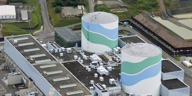 July 7, 2015 - FILE photo shows reactors of No. 1, right, and No. 2 at the Sendai Nuclear Power Station in Satsumasendai, Kagoshima prefecture, southern Japan.  Kyushu Electric Power Co. said it will restart the No. 1 reactor at its Sendai nuclear plant Tuesday morning, Aug. 11.