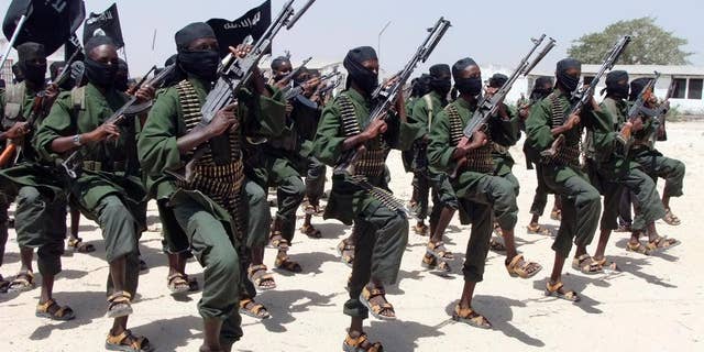 Hundreds of newly trained al-Shabab fighters perform military exercises in the Lafofe area south of Mogadishu, in Somalia.Â 