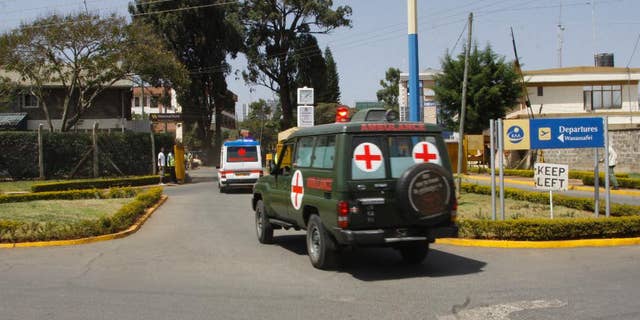 Bodies of Kenyan soldiers are transported by ambulances as they arrive at Wilson airport, Nairobi Kenya, Friday Jan 27, 2017. A spokesman for extremist group al-Shabab says its fighters have killed at least 51 Kenyan soldiers in an attack on an army base in Kulbiyow, a town in Lower Jubba region. (AP Photo/Khalil Senosi)