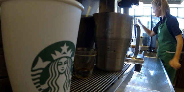 Starbucks says it will expand alcohol sales to "thousands of select stores" over the next several years, although it didn't provide an exact timeline. (Reuters)