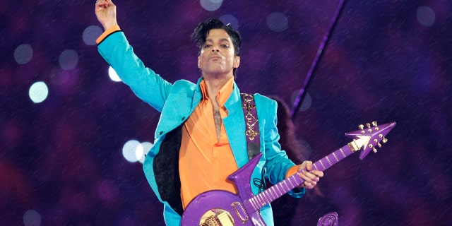 FILE - In this Feb. 4, 2007, file photo, Prince performs during the halftime show at the Super Bowl XLI football game at Dolphin Stadium in Miami. Carver County prosecutors have agreed to provide Prince's siblings with documents connected to their investigation into his death. John Goetz, an attorney for Prince's siblings, says he expects prosecutors will provide the medical examiner's autopsy investigation this week and the remaining investigative files next week. (AP Photo/Chris O'Meara, File)