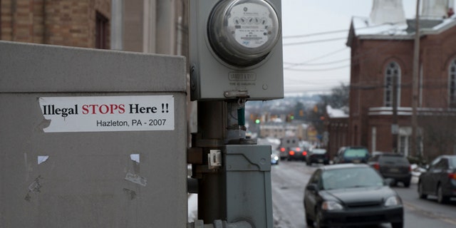 Stickers of the 2006 immigration battle in Hazleton still remain near the town's city hall. (Photo: Andrew O'Reilly)