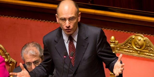 Italian Premier Enrico Letta delivers his speech ahead of a second confidence vote to confirm the government, in the Italian Senate in Rome, Tuesday, April 30, 2013. Italy's new government easily passed its first confirmation vote Monday in Parliament after Premier Enrico Letta made concessions to his uneasy coalition allies, promising to ease part of a slate of austerity measures that have weighed on Italians impatient at the slow pace of economic recovery.  (AP Photo/Alessandra Tarantino)