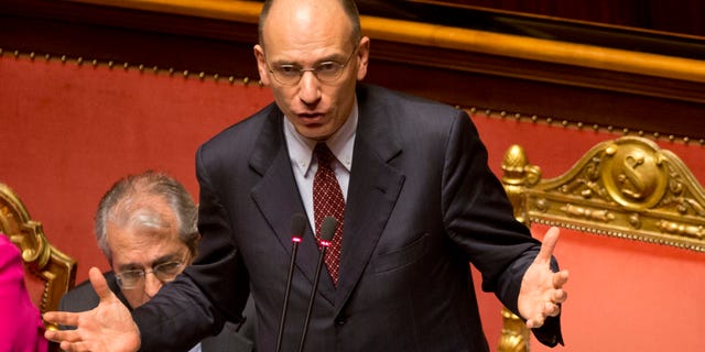 Italian Premier Enrico Letta delivers his speech ahead of a second confidence vote to confirm the government, in the Italian Senate in Rome, Tuesday, April 30, 2013. Italy's new government easily passed its first confirmation vote Monday in Parliament after Premier Enrico Letta made concessions to his uneasy coalition allies, promising to ease part of a slate of austerity measures that have weighed on Italians impatient at the slow pace of economic recovery. (AP Photo/Alessandra Tarantino)