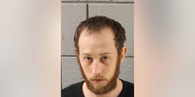 This undated photo provided by the Cumberland County Prison in Carlisle, Pa., shows Joshua Lee Long. Pennsylvania State Police charged Long on Thursday, July 14, 2016, with abuse of a corpse and conspiracy, accusing Long of spraying fluid used to embalm a human brain on marijuana before smoking it. (Cumberland County Prison via AP)