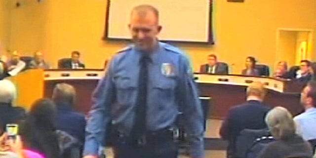 Feb. 11, 2014: Officer Darren Wilson attends a city council meeting in Ferguson